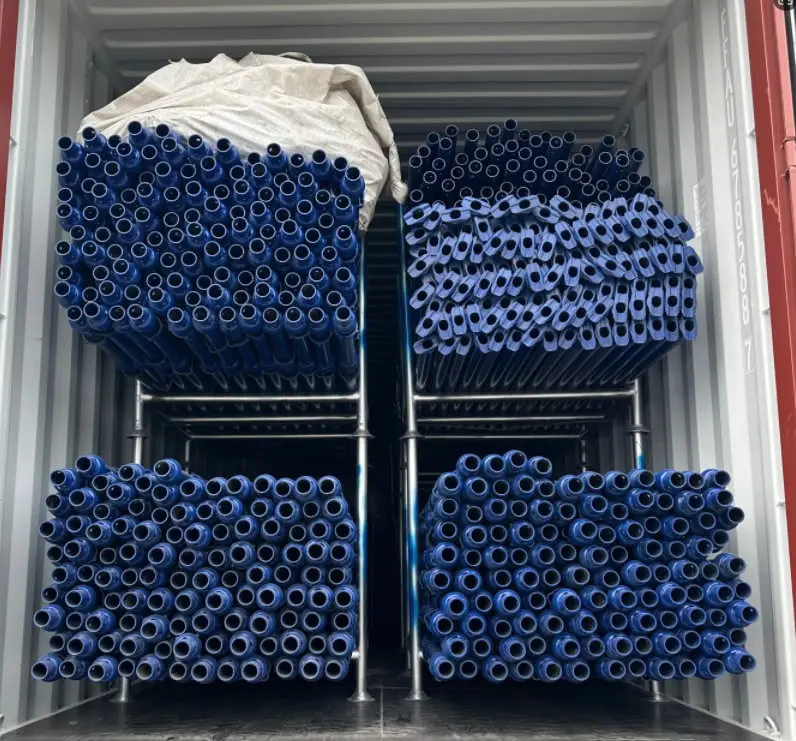 Container loaded with scaffolding tubes for delivery