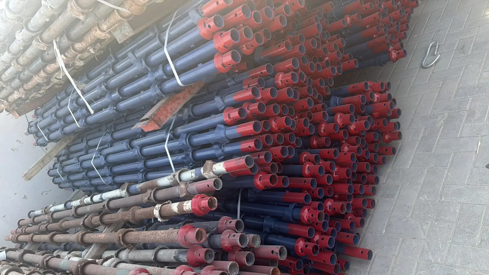 Adjustable steel props sorted and bundled in the yard