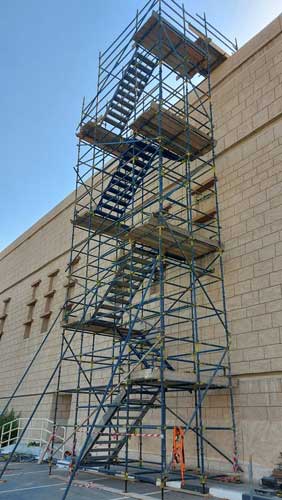 Steel structure being erected with a crane on site